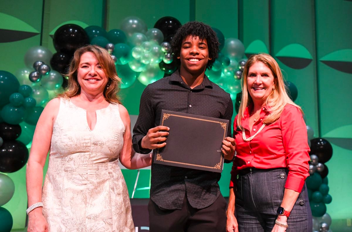 Big brother Jaden Chin recieving a scholarship.